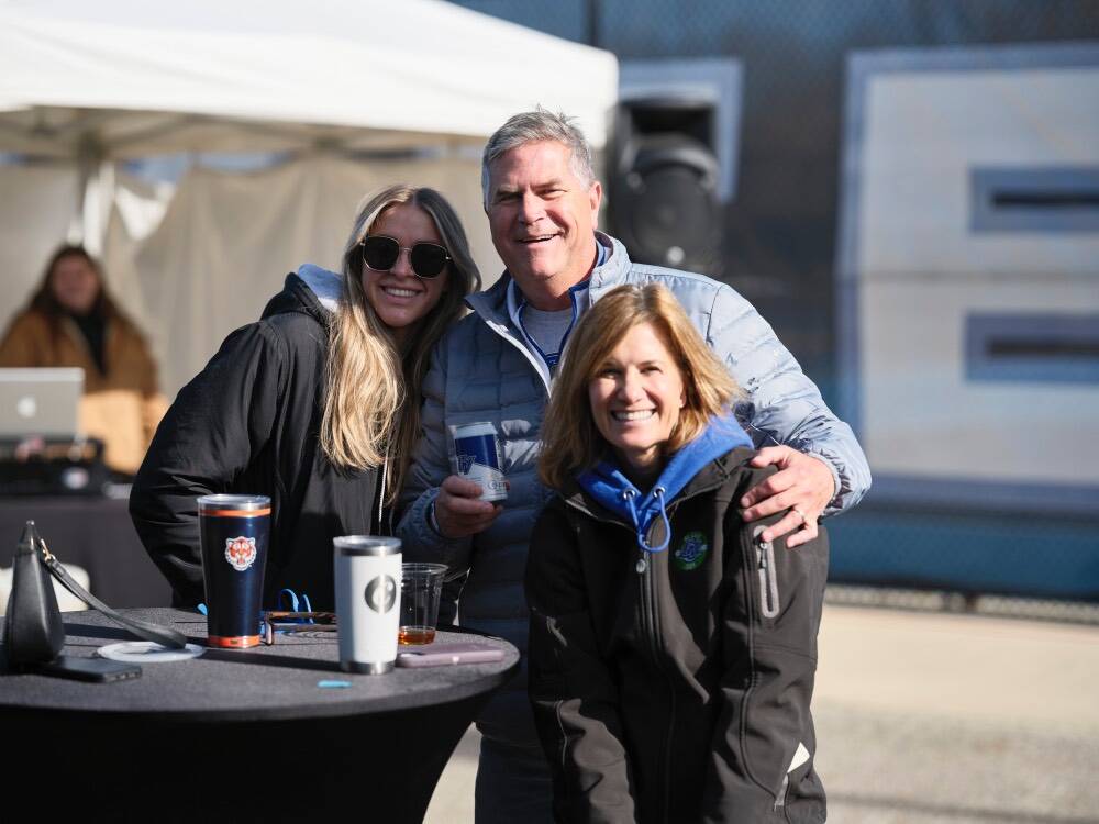 Dad, mom, and daughter at a table